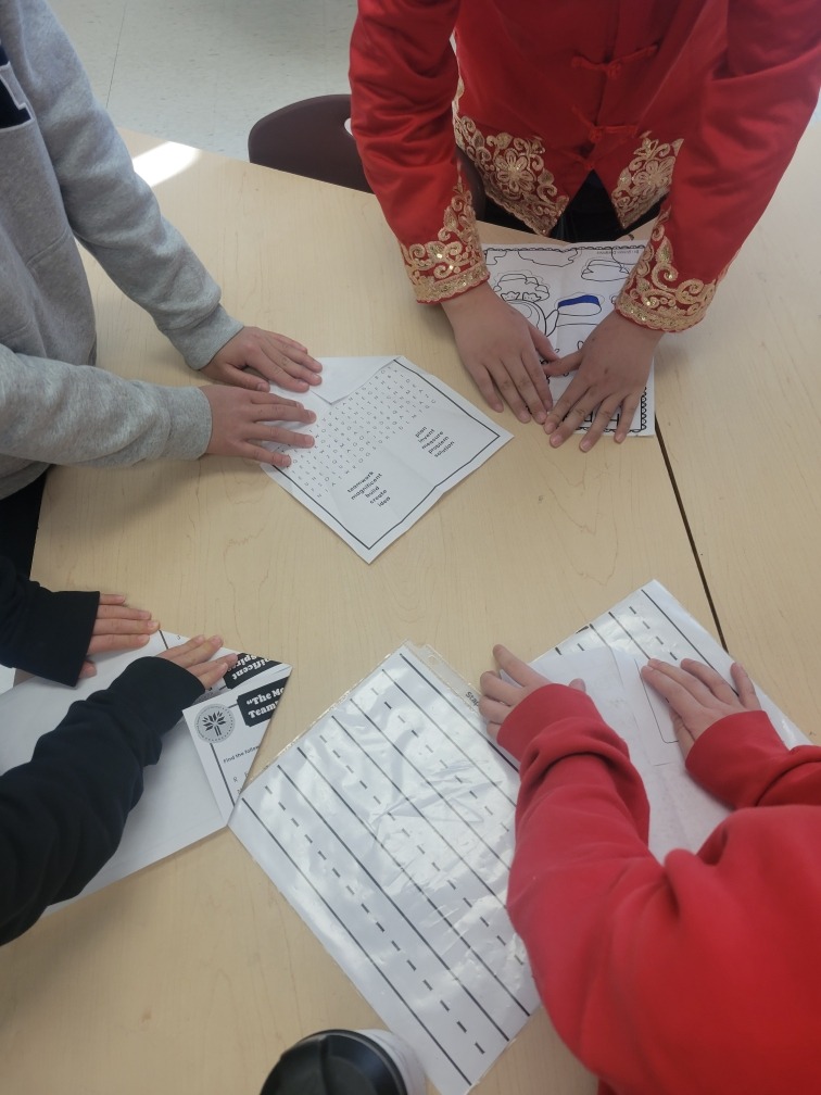 students making paper airplanes
